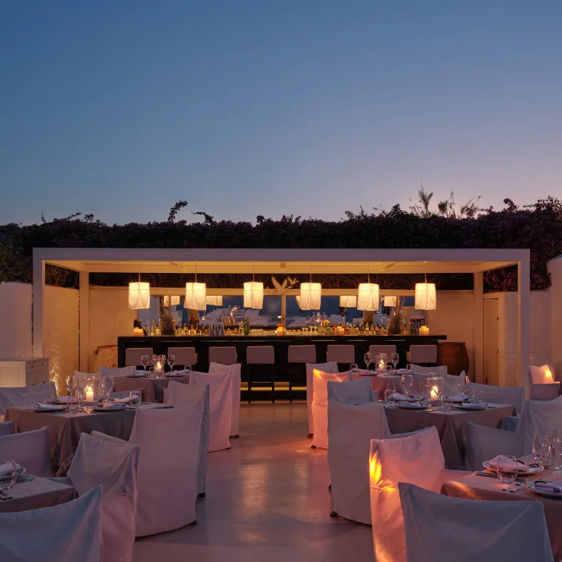 Bougainvillea-covered Privé building overlooking the sea