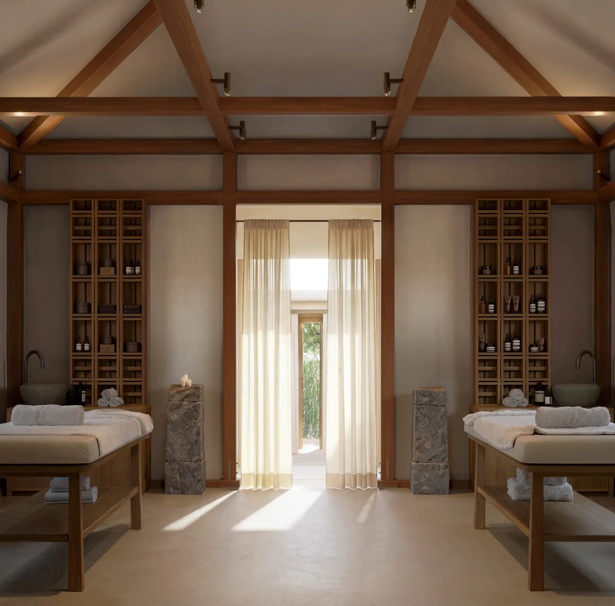 Twin treatment beds in a timber wellness pavilion at The Cabanas