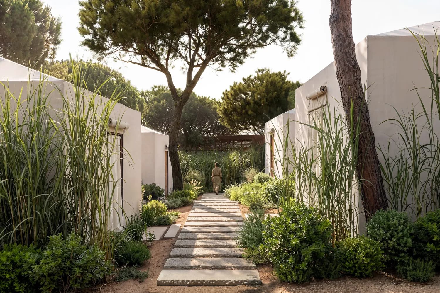 A garden path winding between The Cabanas